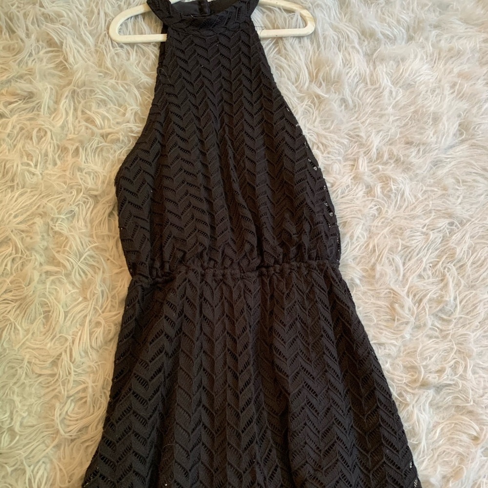 Black halter romper with open back. Gently worn. Size small.